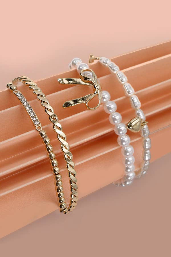 Bow pearl rhinestone bangle set