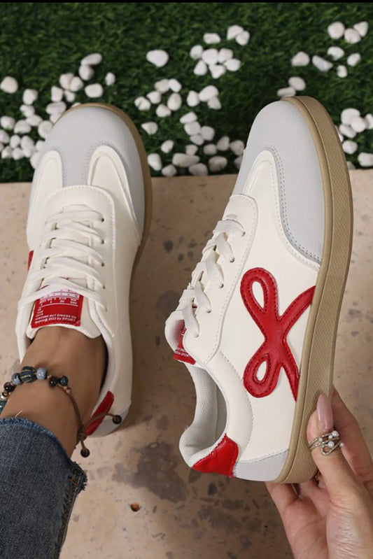 Red bow sneakers