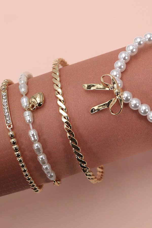 Bow pearl rhinestone bangle set